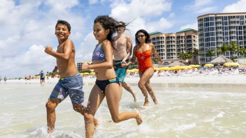 family playing in water